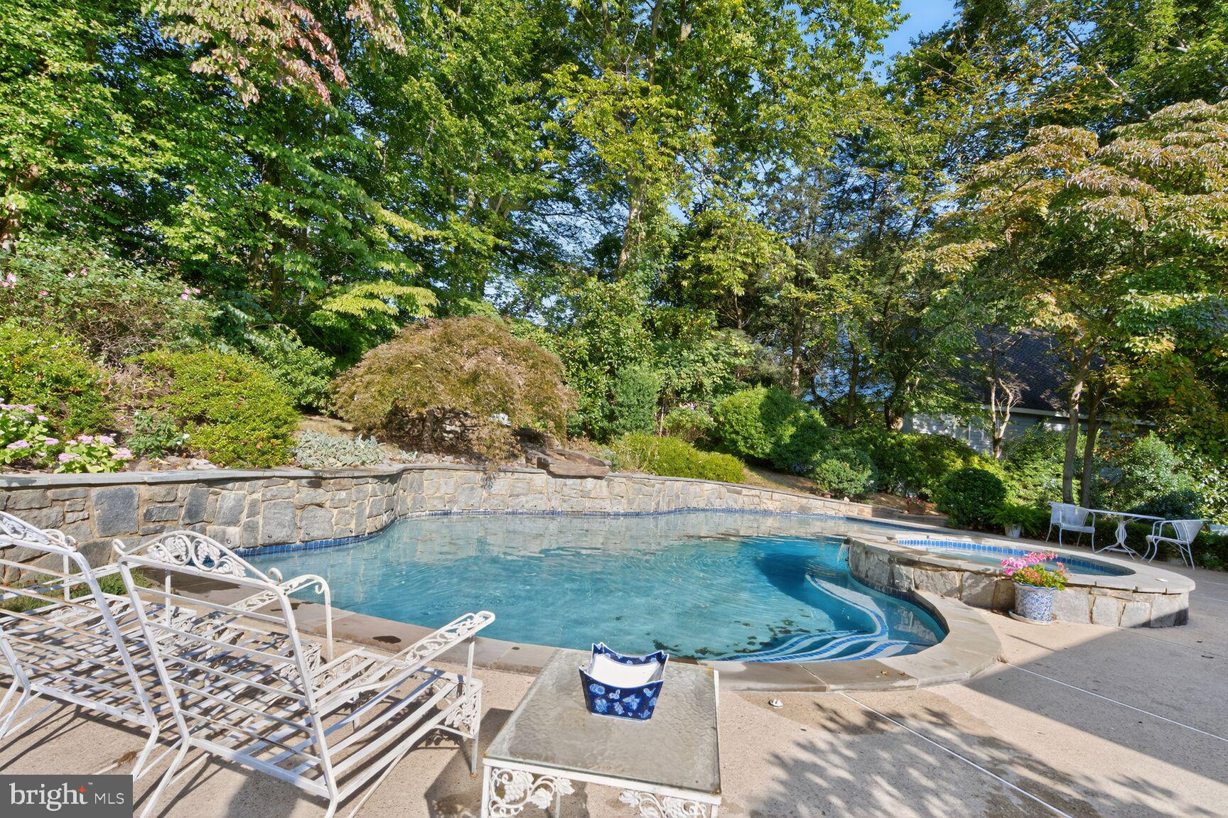 7200 Helmsdale Road Bethesda, MD 20817 - Photo 44 of 50 a view of a swimming pool with a patio