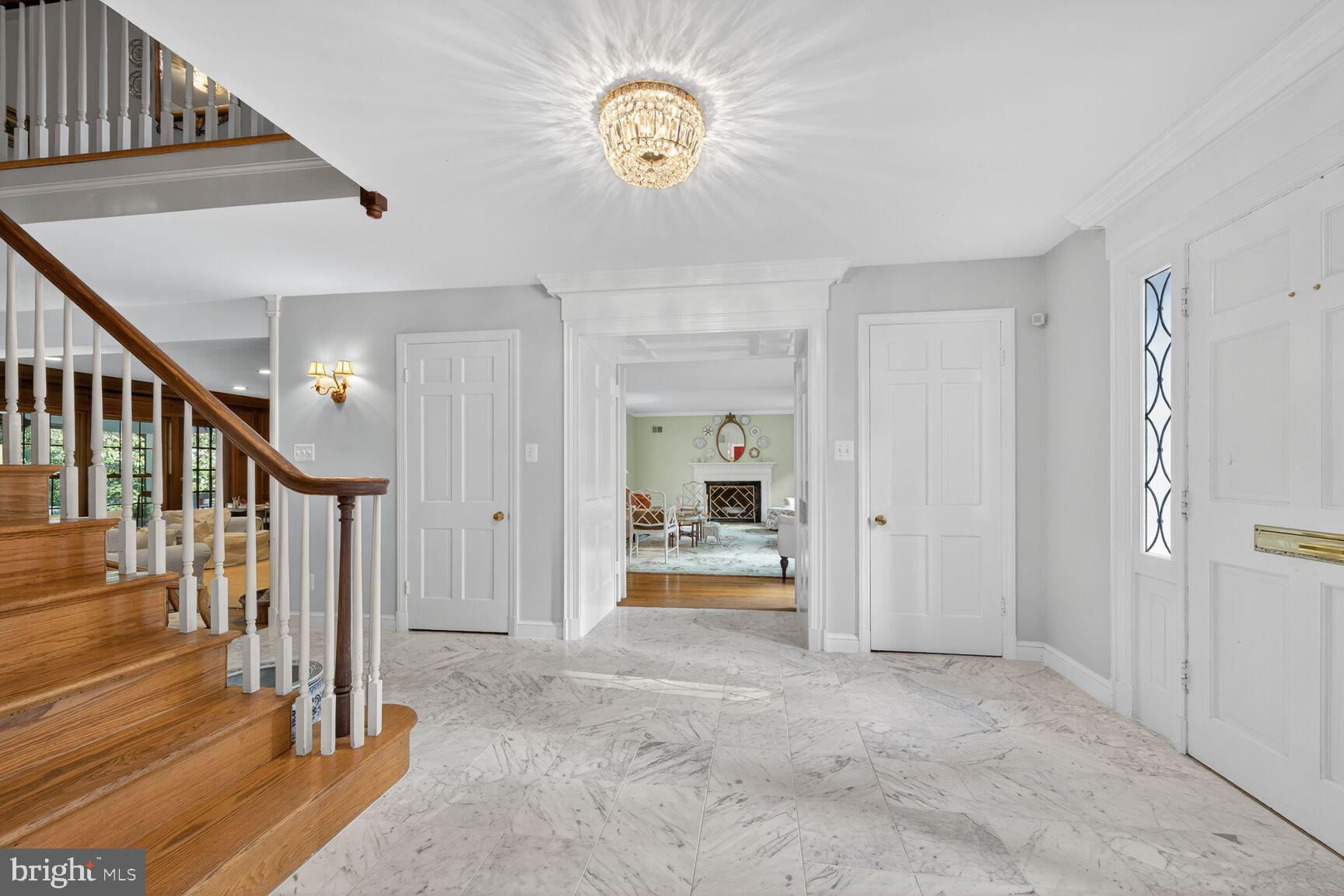 7200 Helmsdale Road Bethesda, MD 20817 - Photo 6 of 50 a view of a hallway with entryway wooden floor and front door