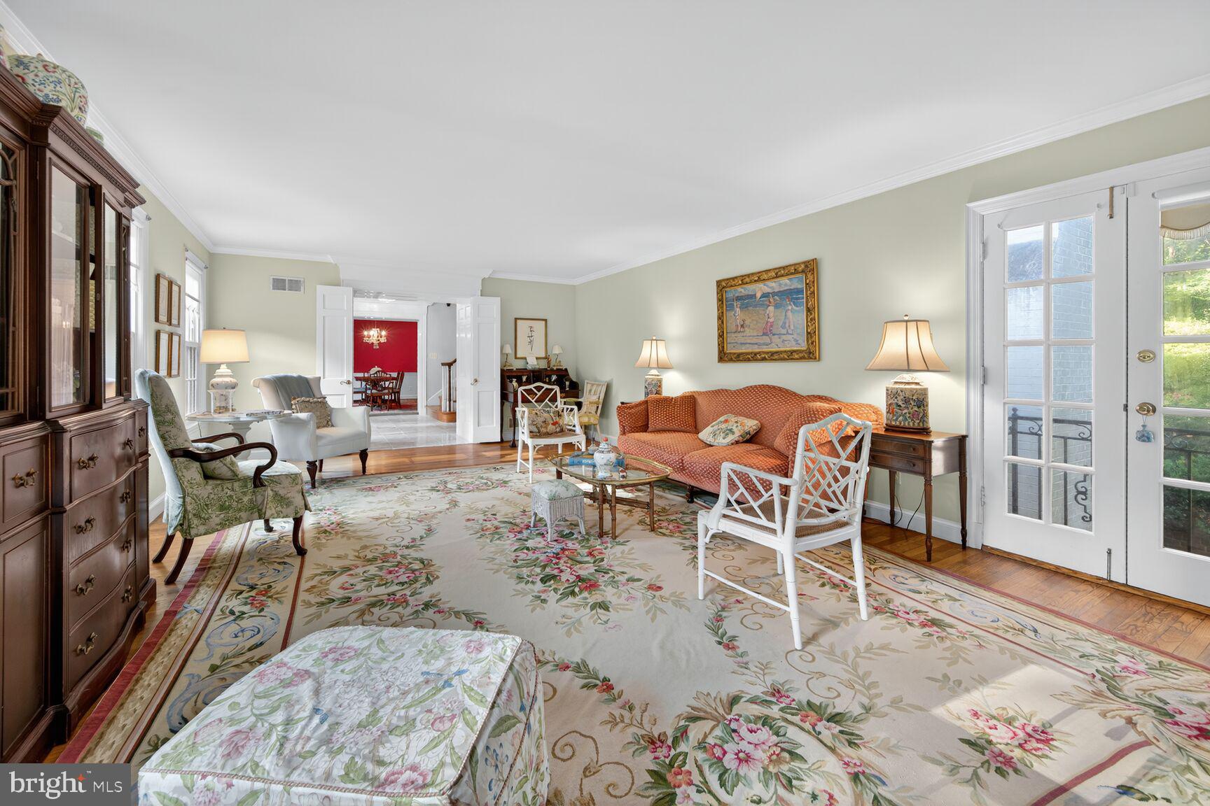 7200 Helmsdale Road Bethesda, MD 20817 - Photo 10 of 50 a living room with furniture a flat screen tv and a rug