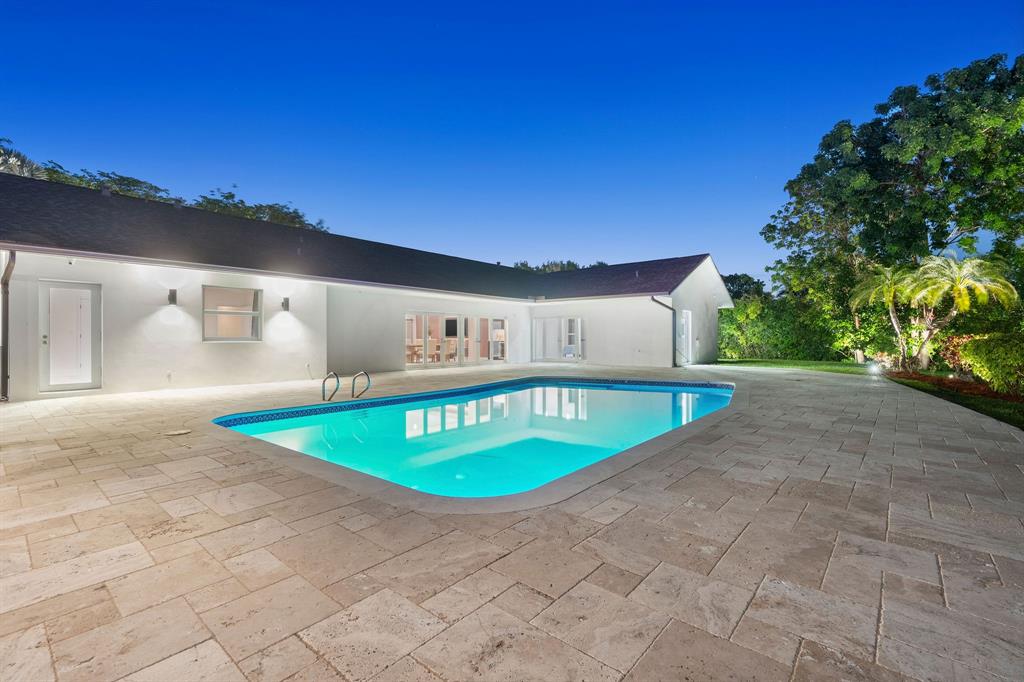 13900 Mustang Trail Southwest Ranches, FL 33330 - Photo 12 of 68 a view of a swimming pool with an outdoor seating