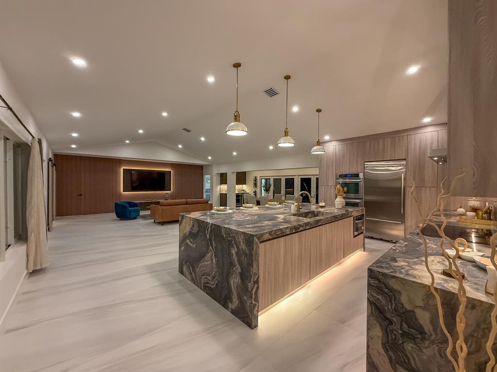 13900 Mustang Trail Southwest Ranches, FL 33330 - Photo 27 of 68 a large kitchen with stainless steel appliances kitchen island granite countertop a large counter top and oven