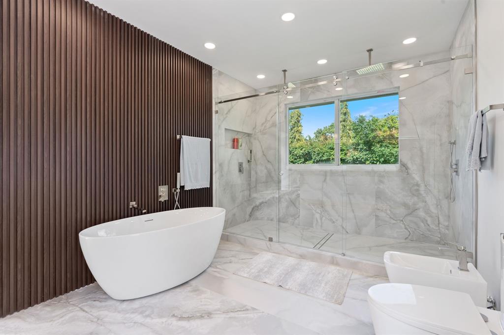 13900 Mustang Trail Southwest Ranches, FL 33330 - Photo 33 of 68 a bathroom with a bathtub and toilet