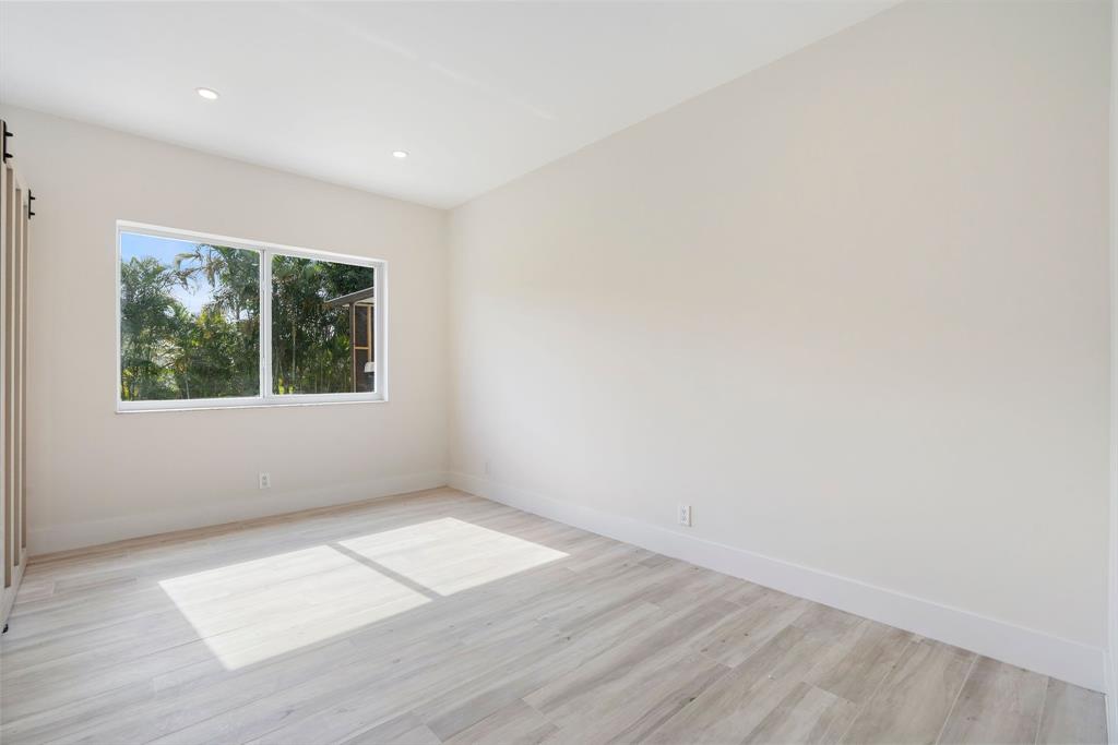 13900 Mustang Trail Southwest Ranches, FL 33330 - Photo 40 of 68 an empty room with wooden floor and windows
