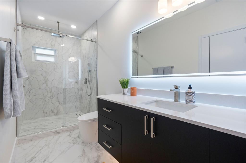13900 Mustang Trail Southwest Ranches, FL 33330 - Photo 49 of 68 a bathroom with a shower sink vanity granite and shower