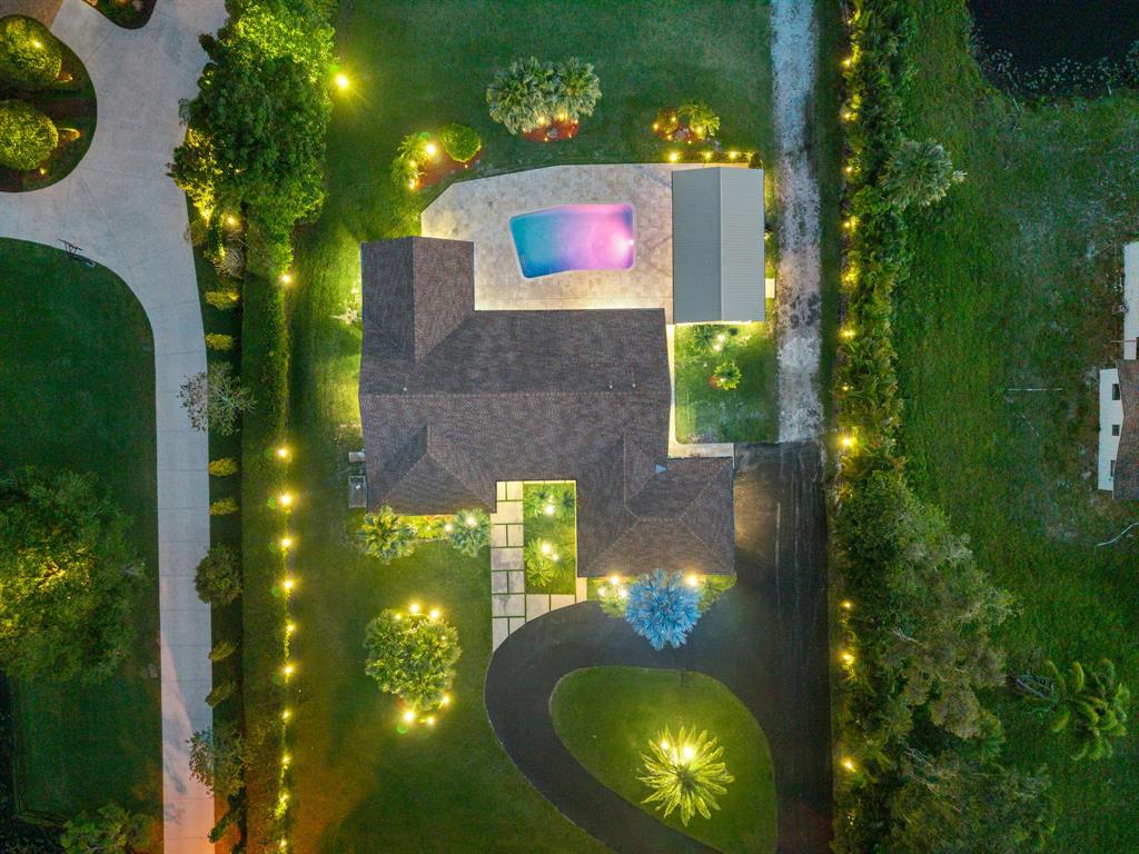 13900 Mustang Trail Southwest Ranches, FL 33330 - Photo 5 of 68 a view of a house with a swimming pool