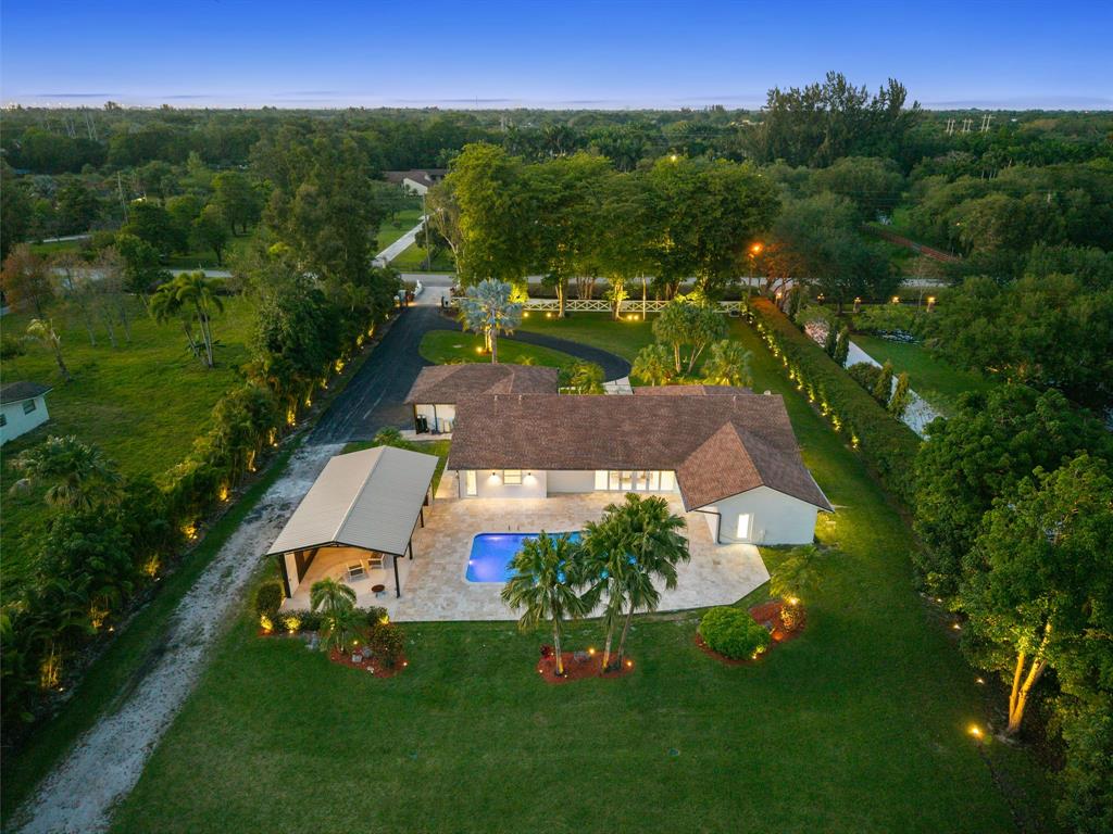 13900 Mustang Trail Southwest Ranches, FL 33330 - Photo 58 of 68 an aerial view of a house with a yard