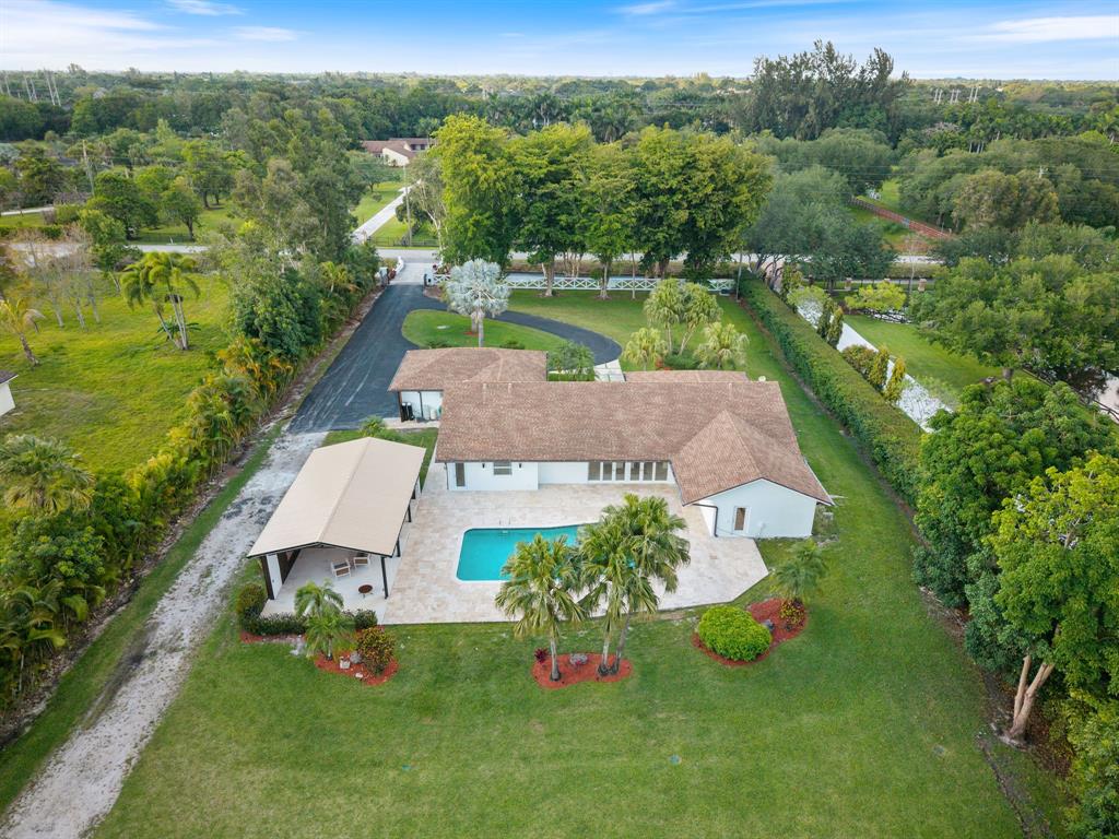 13900 Mustang Trail Southwest Ranches, FL 33330 - Photo 59 of 68 an aerial view of a house with pool