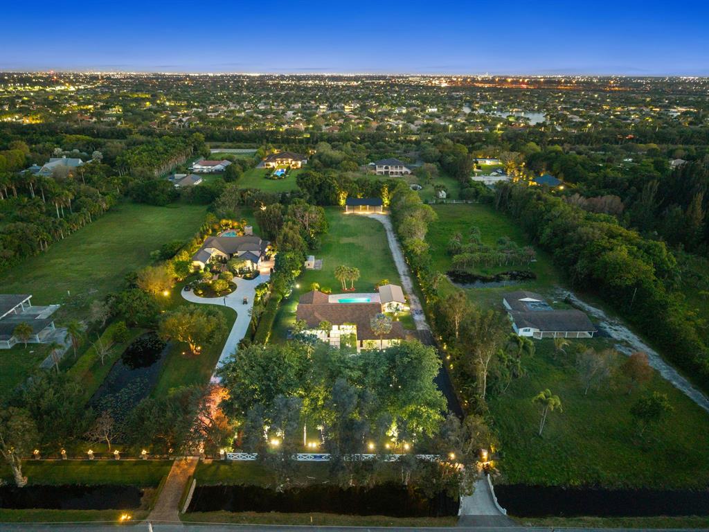 13900 Mustang Trail Southwest Ranches, FL 33330 - Photo 6 of 68 an aerial view of residential houses with outdoor space and trees