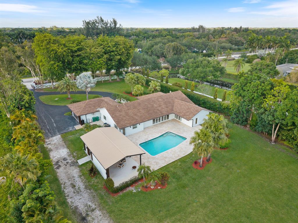 13900 Mustang Trail Southwest Ranches, FL 33330 - Photo 61 of 68 an aerial view of a house with a garden