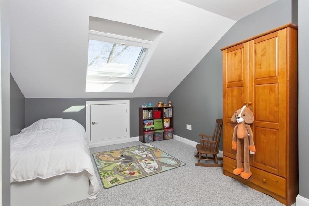 797 Highland Avenue, Unit 4 Needham, MA 02494 - Photo 13 of 21 a bedroom with a bed and a window