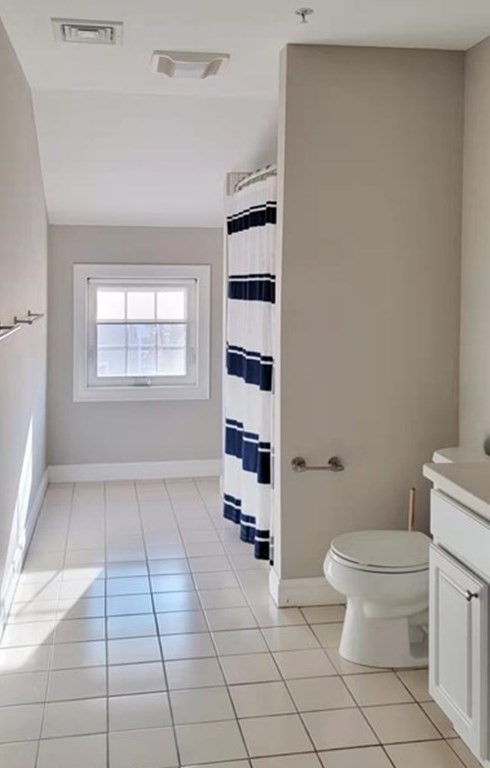 797 Highland Avenue, Unit 4 Needham, MA 02494 - Photo 14 of 21 a bathroom with a toilet a sink and a shower