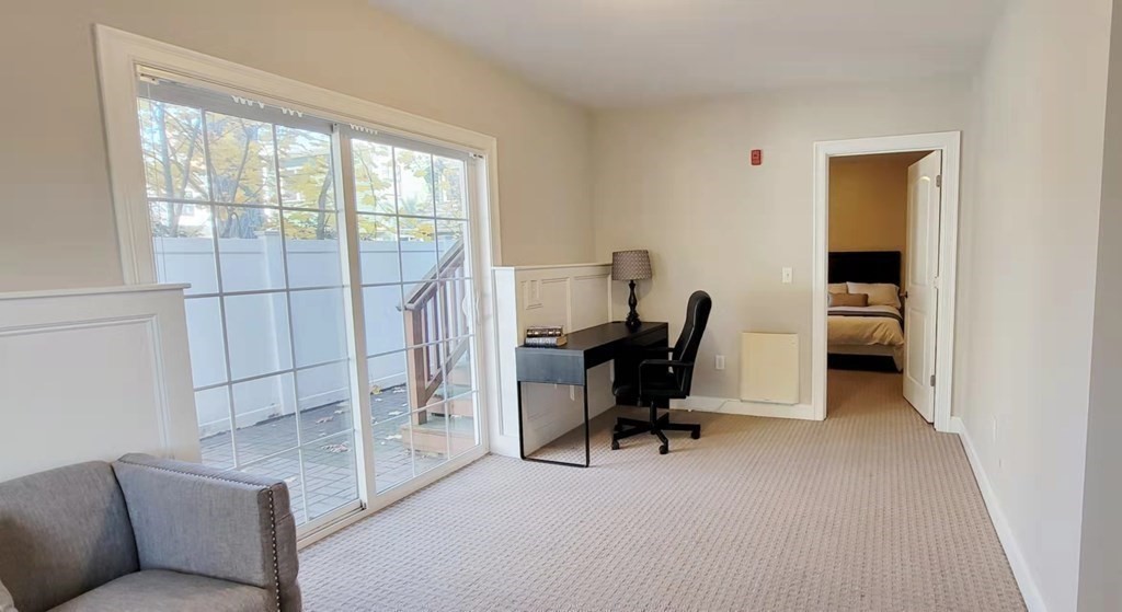 797 Highland Avenue, Unit 4 Needham, MA 02494 - Photo 16 of 21 a view of a livingroom with workspace and a couch