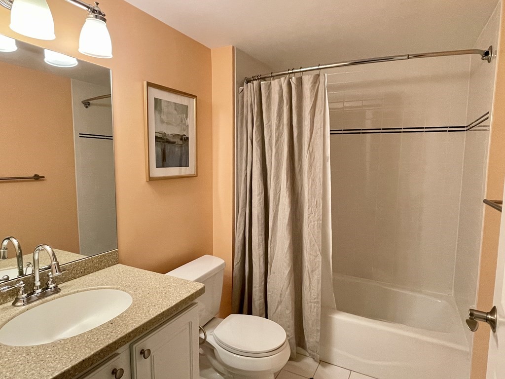 797 Highland Avenue, Unit 4 Needham, MA 02494 - Photo 18 of 21 a bathroom with a sink a toilet and shower