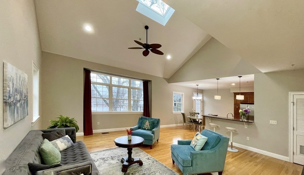 797 Highland Avenue, Unit 4 Needham, MA 02494 - Photo 5 of 21 a living room with furniture and a large window