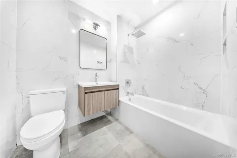 a bathroom with a sink toilet and bathtub