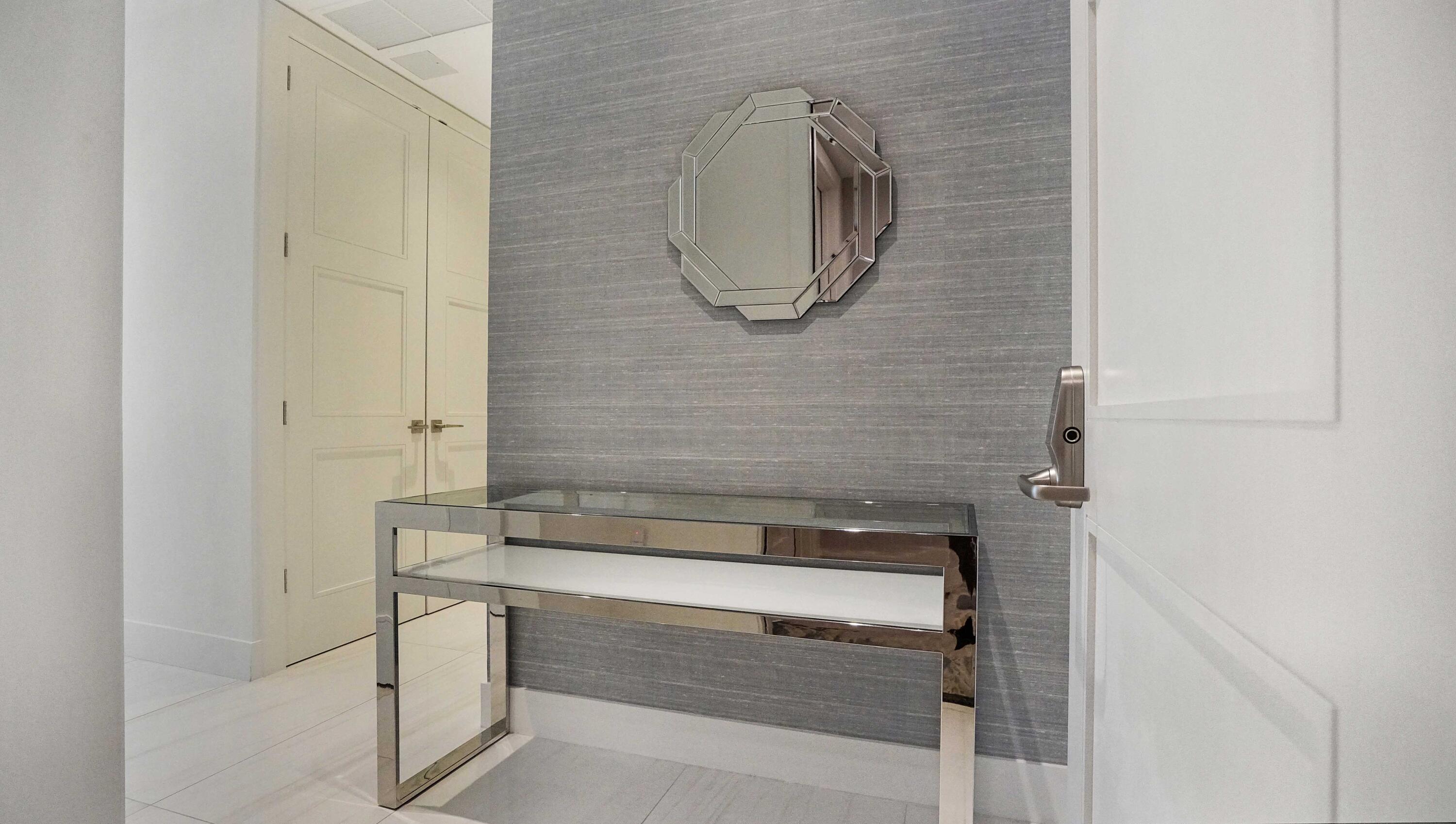 155 East Boca Raton Road, Unit 501 Boca Raton, FL 33432 - Photo 41 of 83 a bathroom with a mirror and a shower