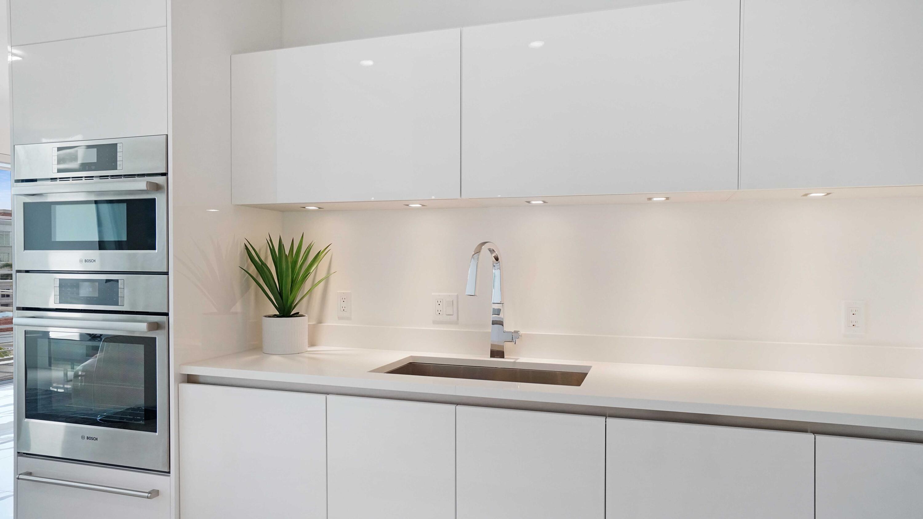 155 East Boca Raton Road, Unit 501 Boca Raton, FL 33432 - Photo 42 of 83 a kitchen with a sink and white cabinets