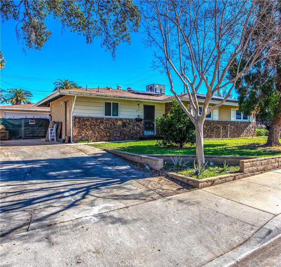 237 Roma Street Redlands, CA 92373 - Photo 1 of 1 a view of a house with a yard porch and sitting area