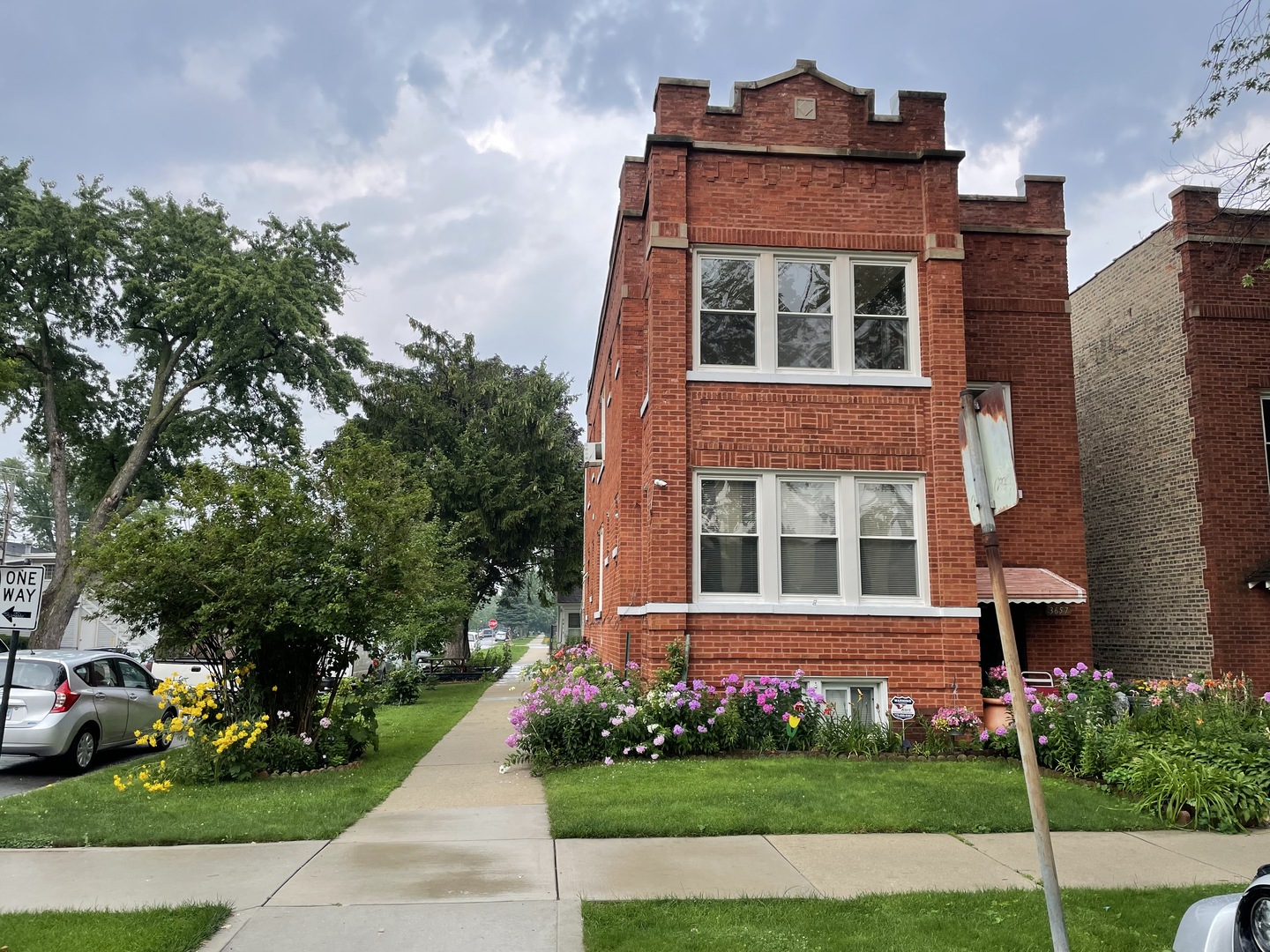 3657 North Lotus Avenue Chicago, IL 60641 - Photo 2 of 29 front view of building with a yard