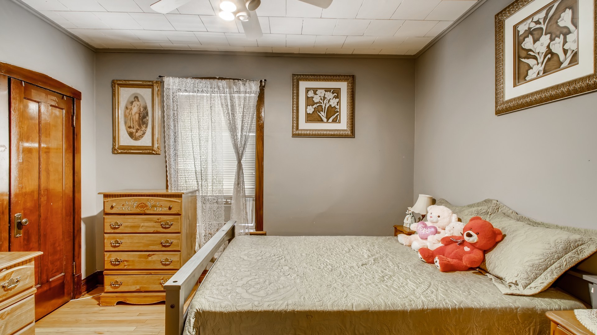 3657 North Lotus Avenue Chicago, IL 60641 - Photo 11 of 29 a bedroom with a bed and wooden floor