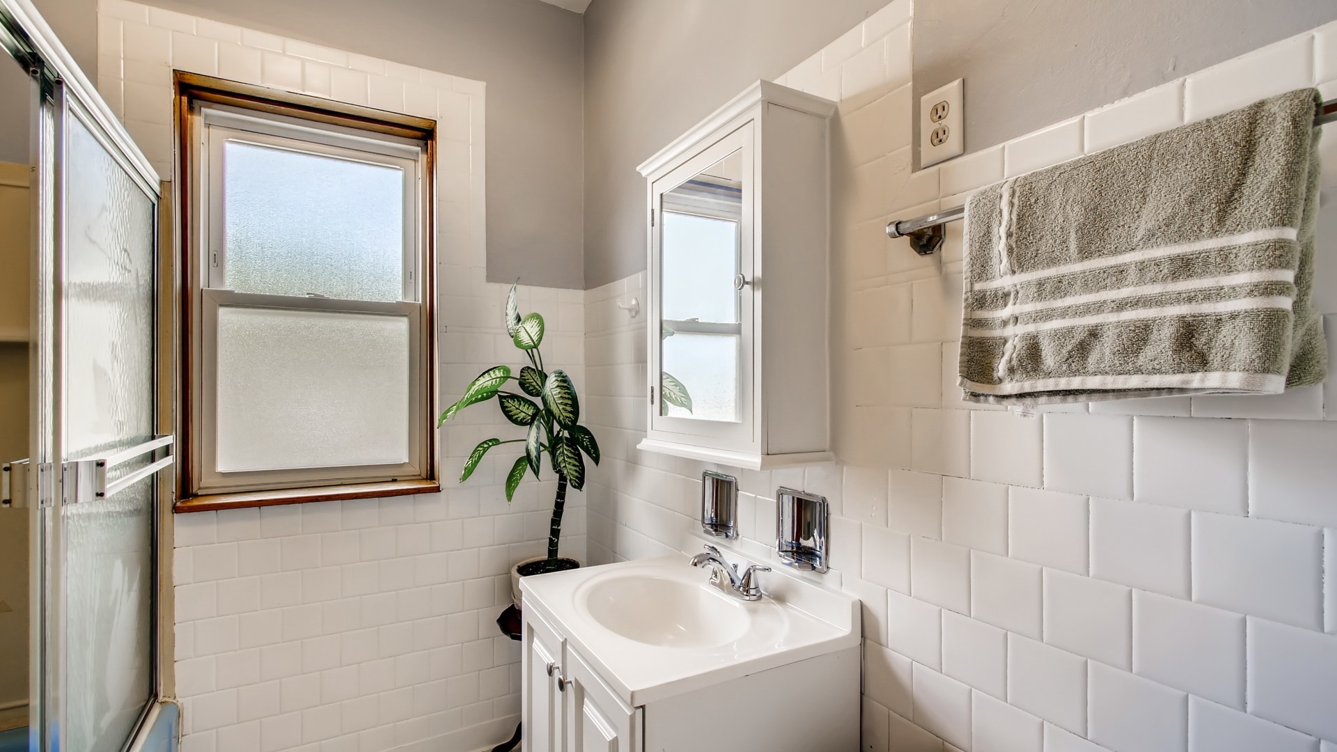 3657 North Lotus Avenue Chicago, IL 60641 - Photo 16 of 29 a bathroom with a sink and a mirror