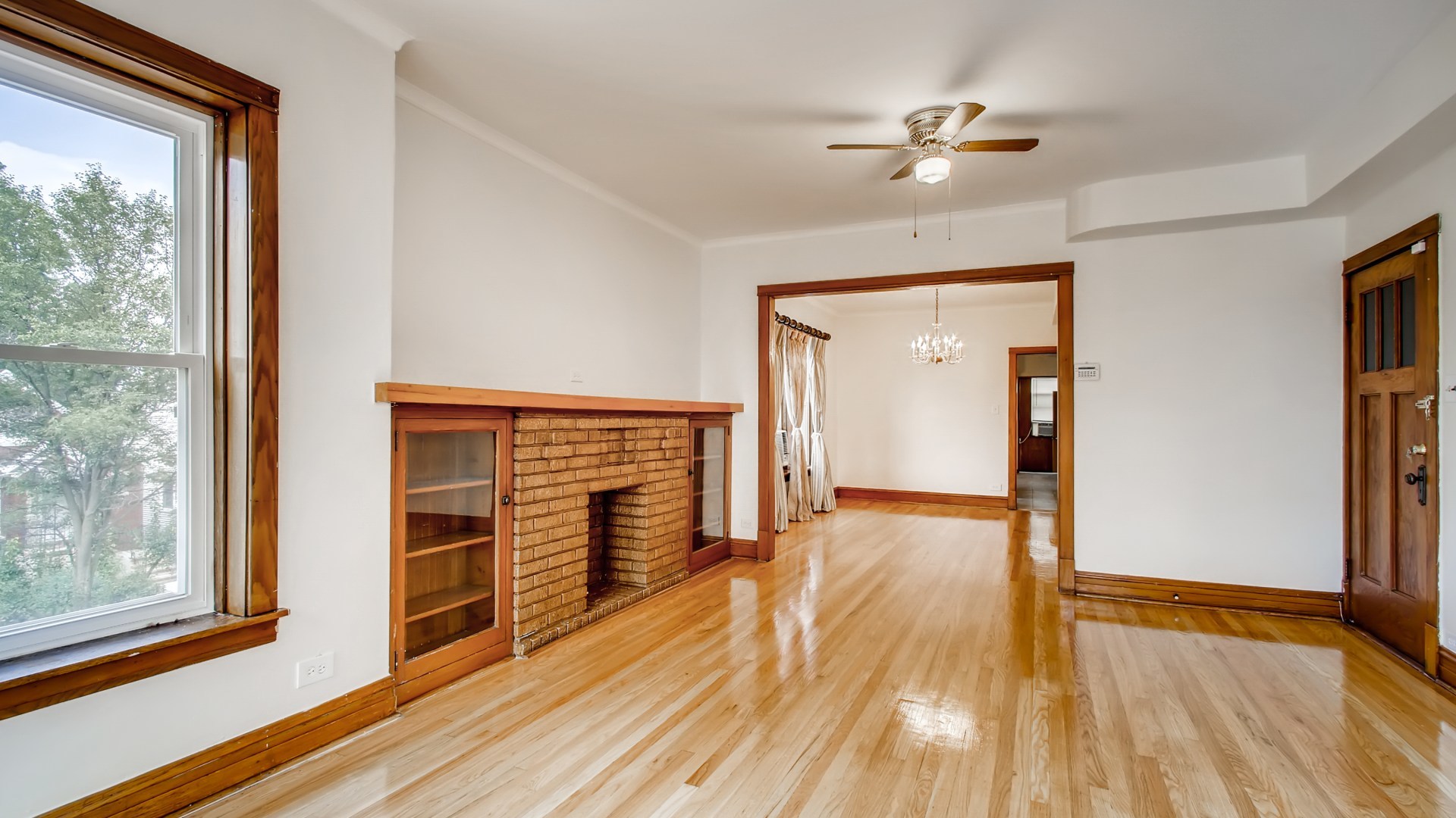 3657 North Lotus Avenue Chicago, IL 60641 - Photo 18 of 29 wooden floor in an empty room with a window