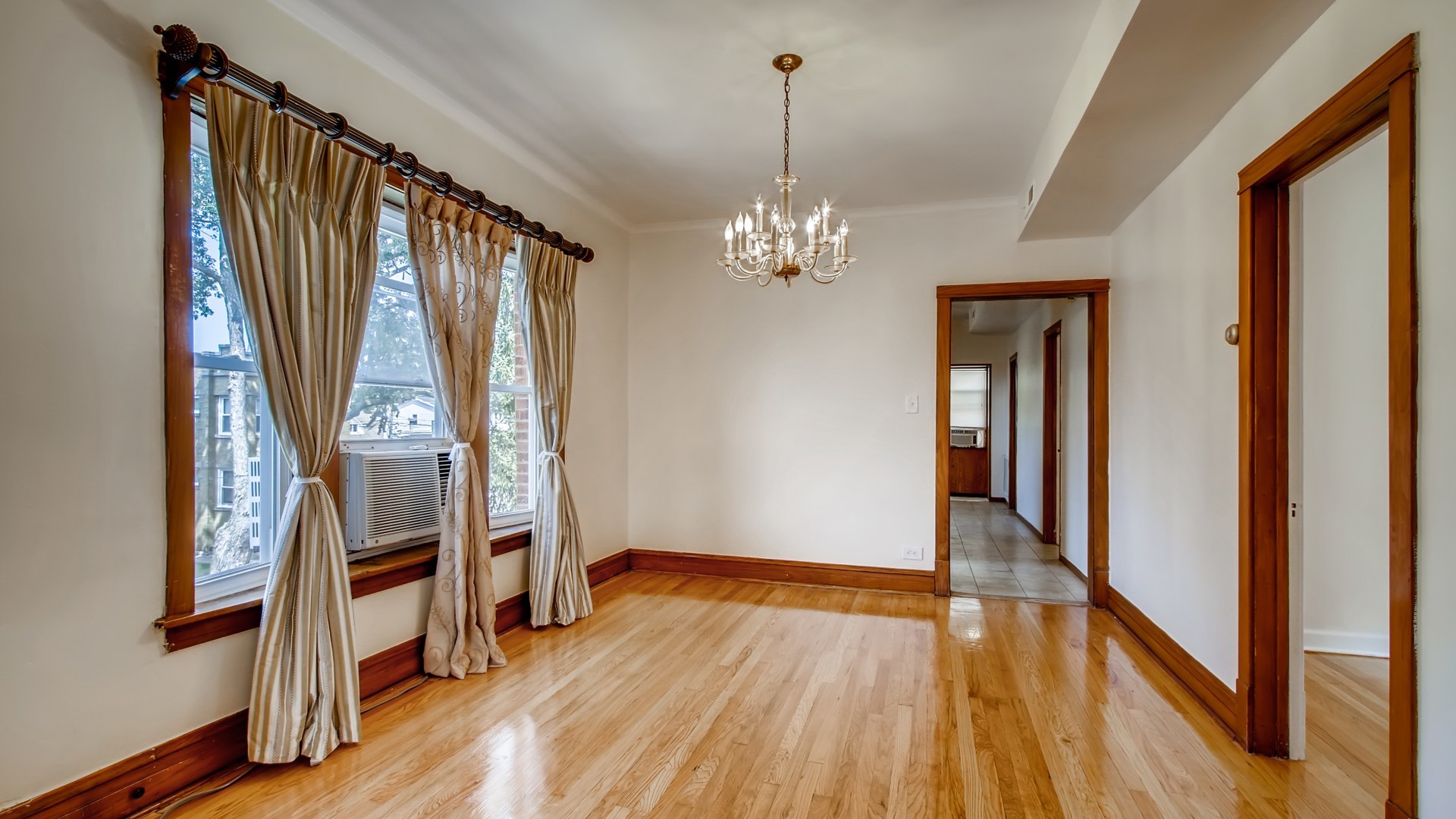 3657 North Lotus Avenue Chicago, IL 60641 - Photo 19 of 29 a view of an entryway with wooden floor and stairs
