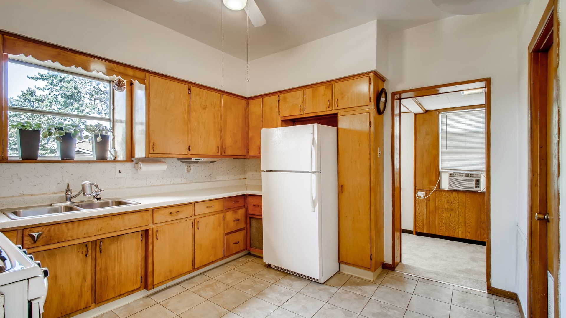 3657 North Lotus Avenue Chicago, IL 60641 - Photo 20 of 29 a kitchen with a refrigerator and a sink