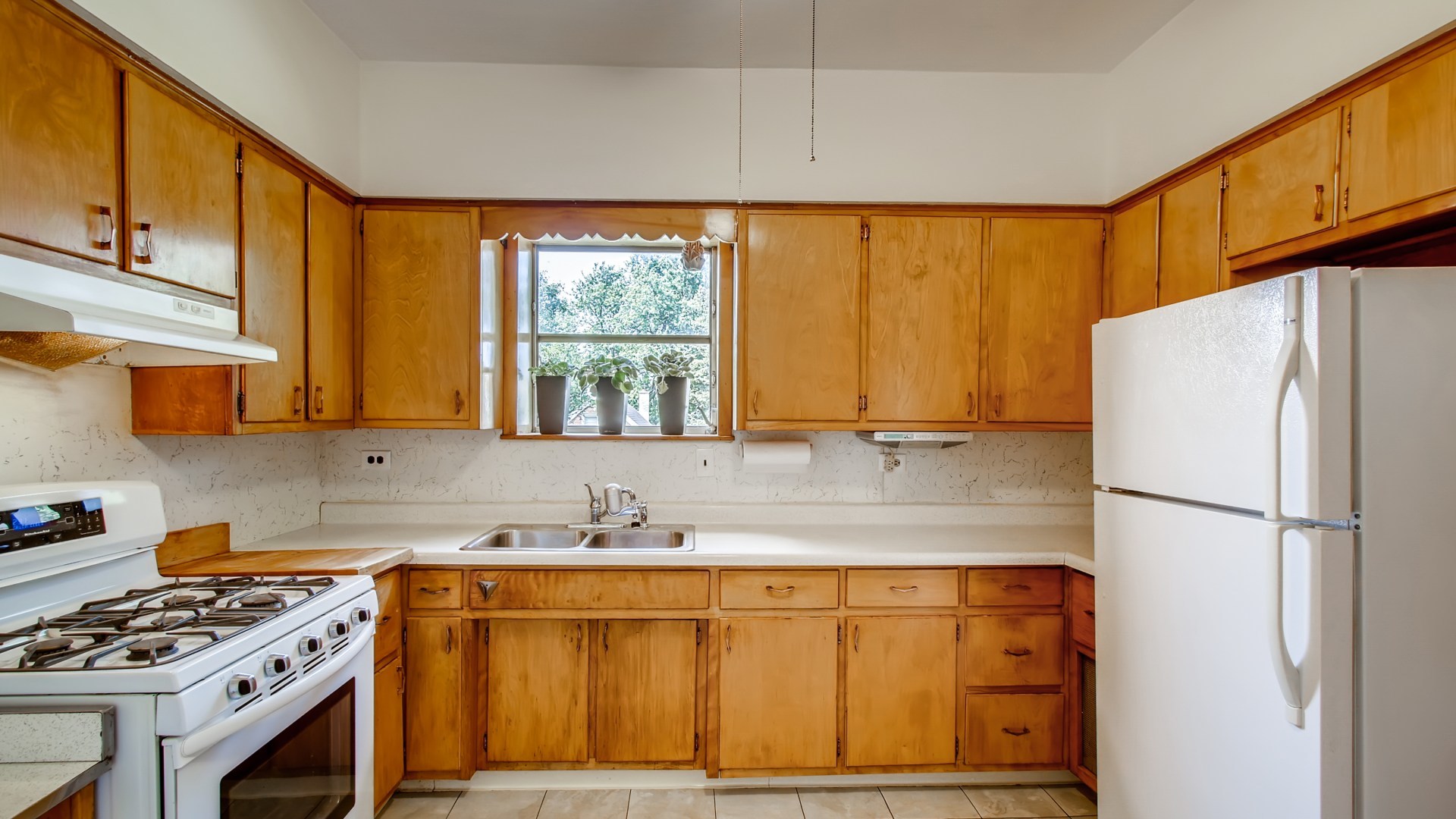 3657 North Lotus Avenue Chicago, IL 60641 - Photo 21 of 29 a kitchen with stainless steel appliances granite countertop a sink stove and refrigerator