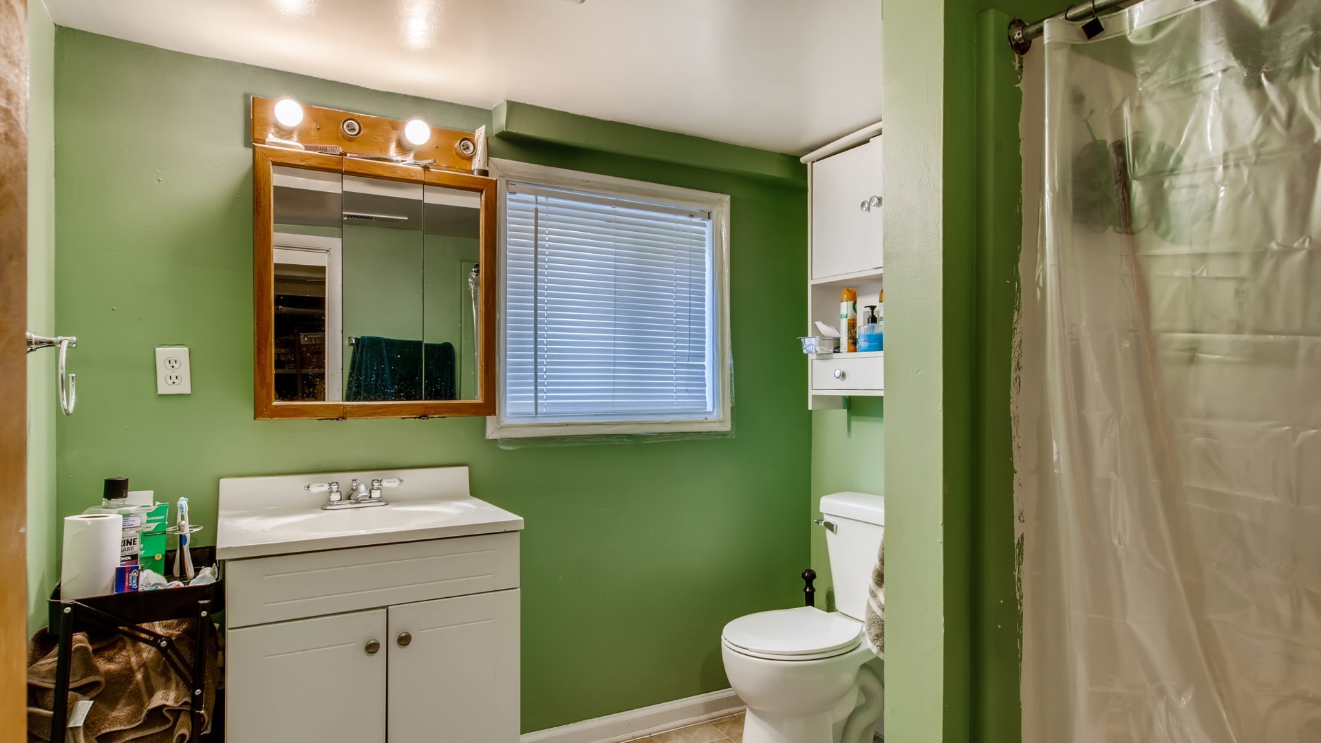 3657 North Lotus Avenue Chicago, IL 60641 - Photo 24 of 29 a bathroom with a sink a toilet and a mirror