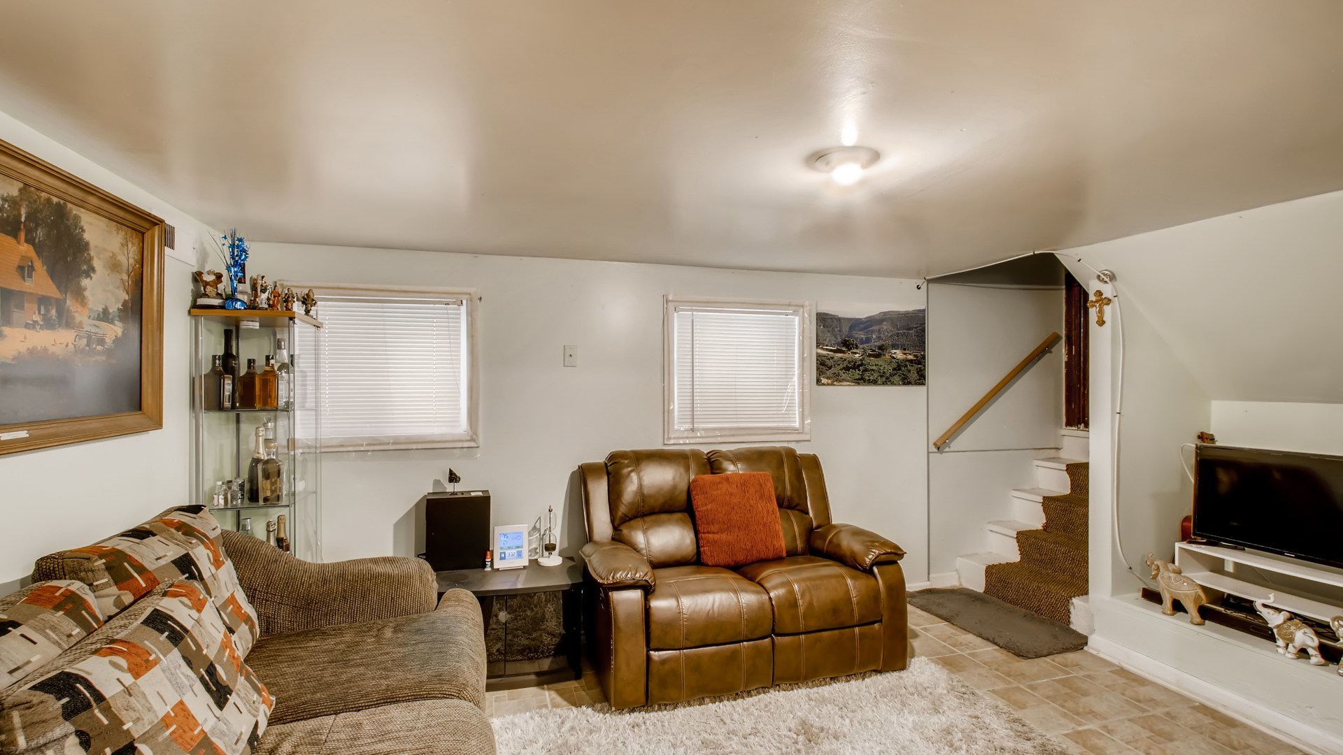 3657 North Lotus Avenue Chicago, IL 60641 - Photo 25 of 29 a living room with furniture and a flat screen tv