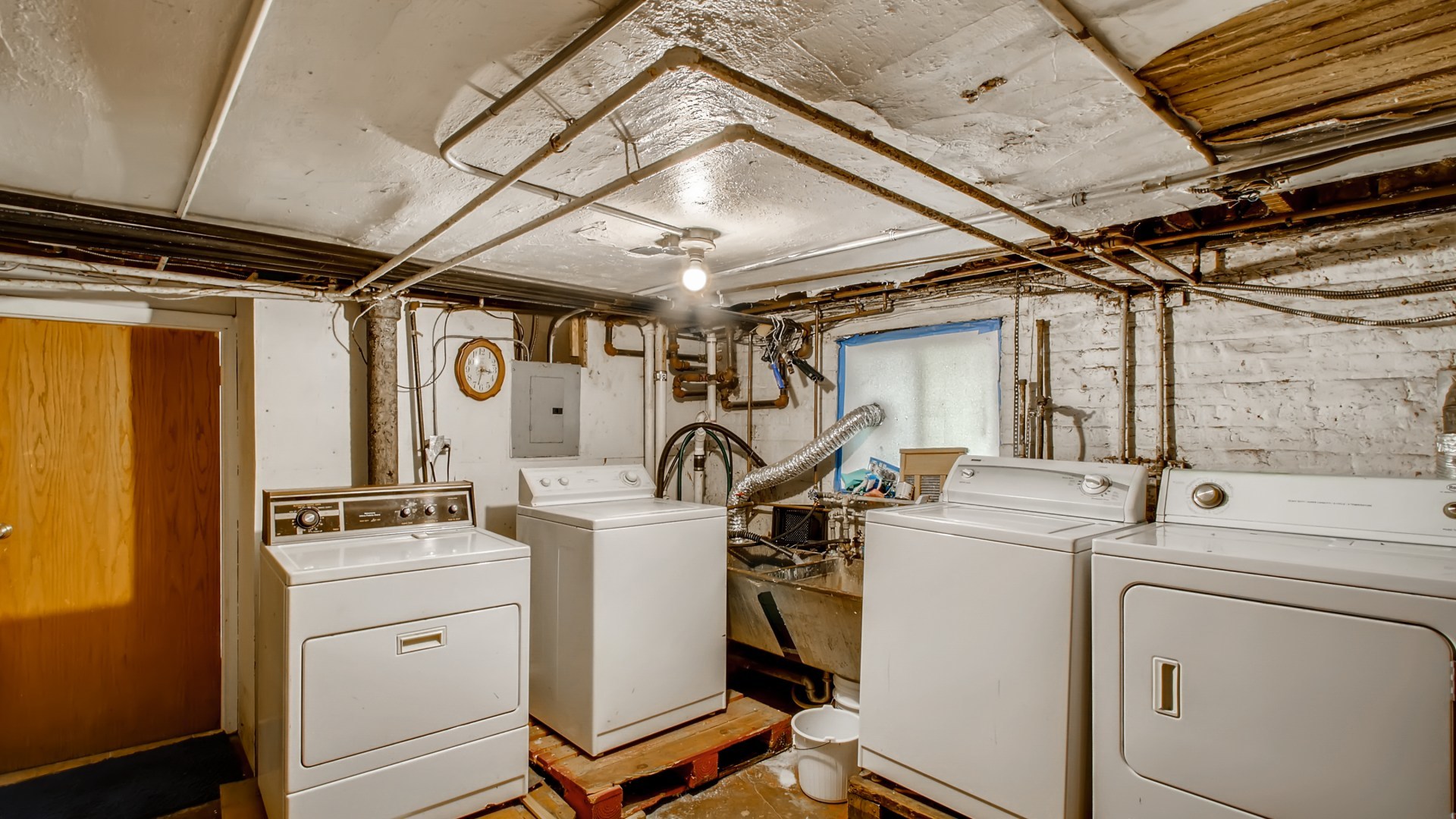3657 North Lotus Avenue Chicago, IL 60641 - Photo 26 of 29 a view of a storage & utility room with washer and dryer