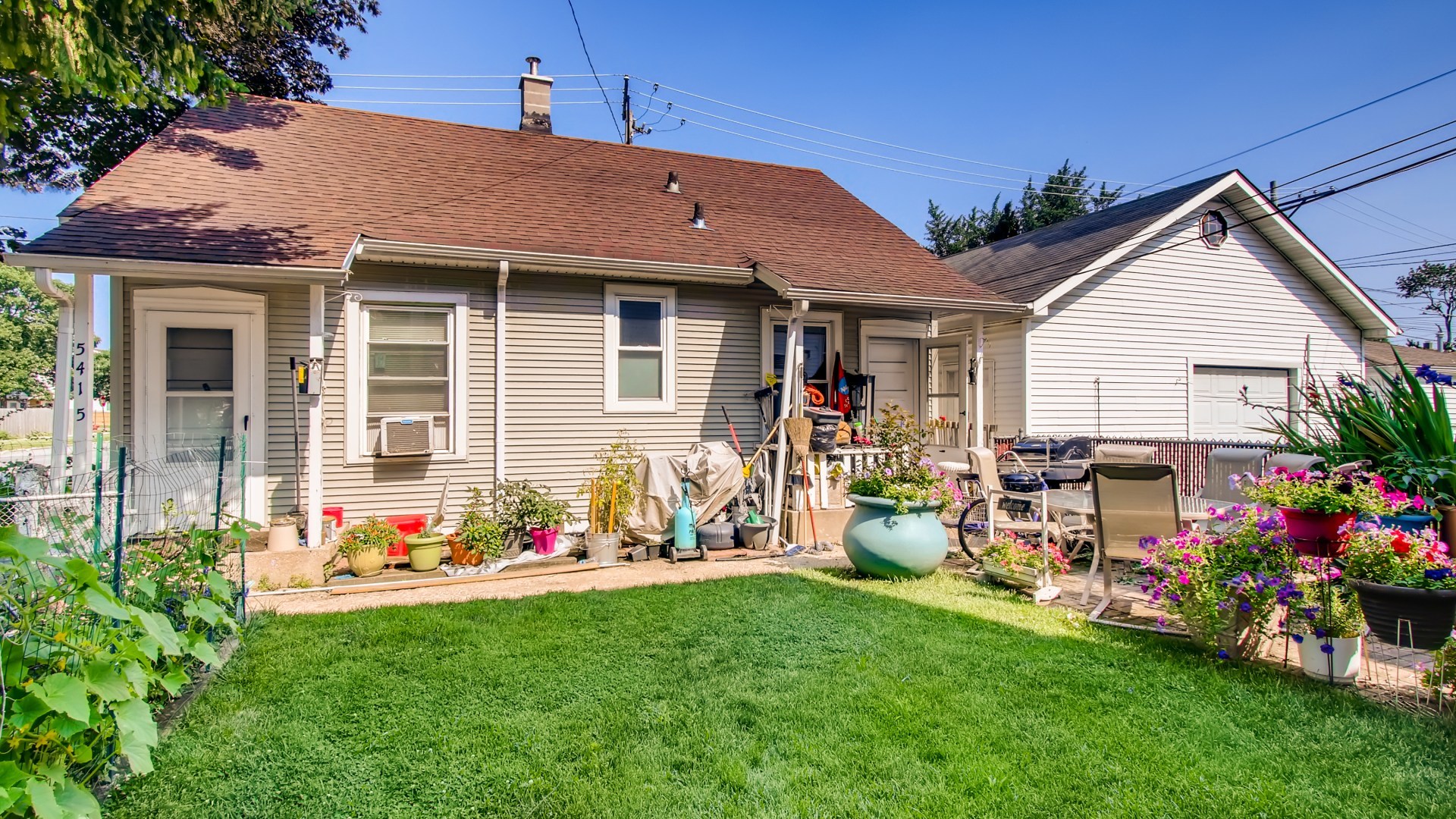 3657 North Lotus Avenue Chicago, IL 60641 - Photo 27 of 29 a front view of house with an outdoor seating