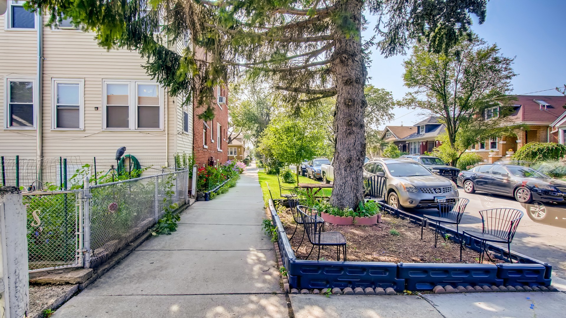 3657 North Lotus Avenue Chicago, IL 60641 - Photo 29 of 29 a view of a house with sitting area and garden
