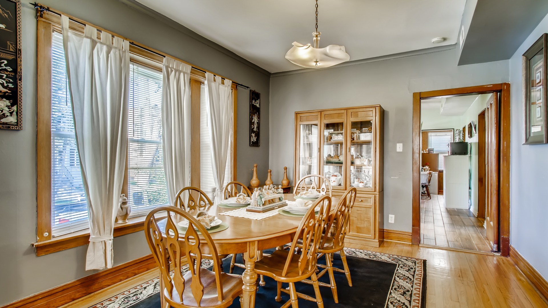 3657 North Lotus Avenue Chicago, IL 60641 - Photo 6 of 29 a view of a dining room with furniture and chandelier