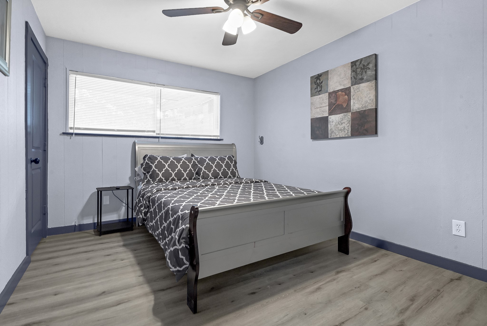 11103 Greenwillow Street Houston, TX 77035 - Photo 12 of 27 a bed sitting in a bedroom next to a window