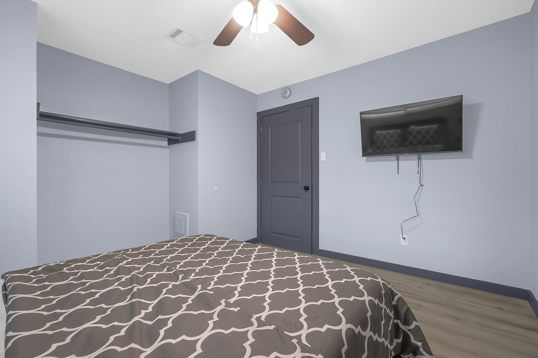 11103 Greenwillow Street Houston, TX 77035 - Photo 18 of 27 a bedroom with a bed and a flat screen tv