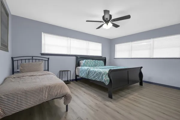 a bedroom with a bed and window