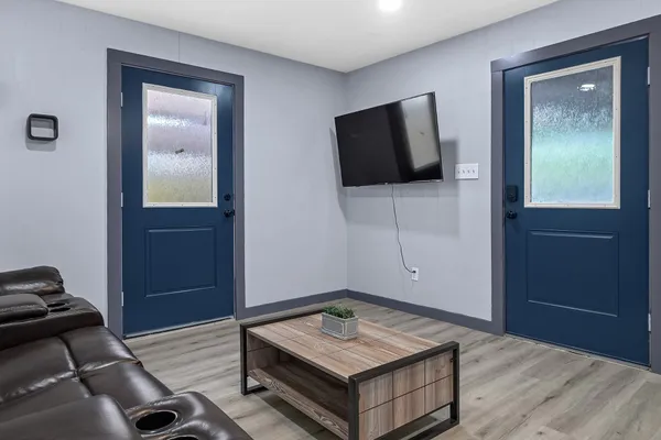 a living room with furniture and a flat screen tv