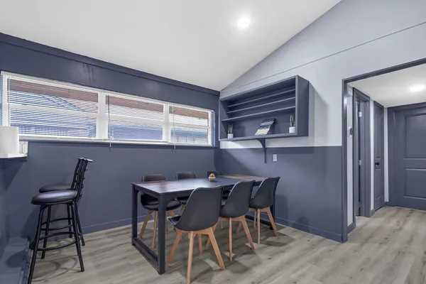 a view of a dining room with furniture and window