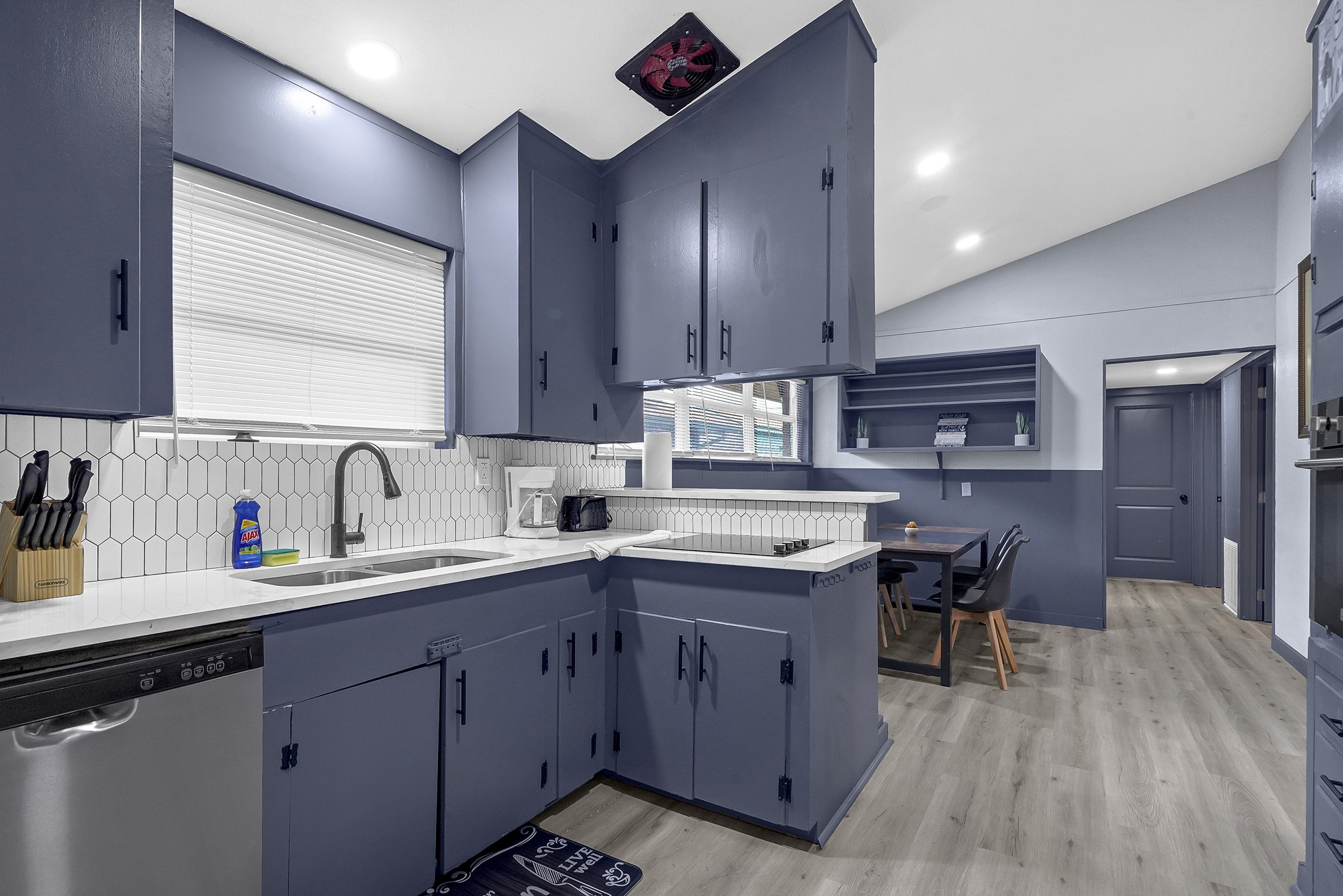 11103 Greenwillow Street Houston, TX 77035 - Photo 9 of 27 a kitchen with a sink window and cabinets