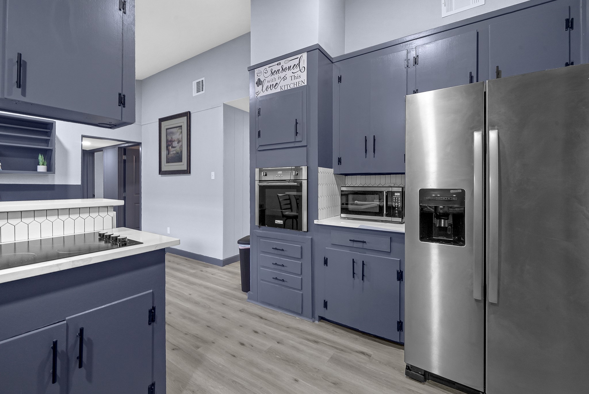 11103 Greenwillow Street Houston, TX 77035 - Photo 10 of 27 a kitchen with stainless steel appliances granite countertop a refrigerator and a stove top oven