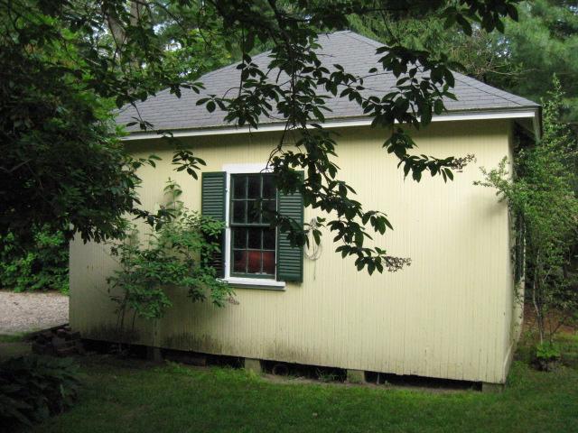 5 Squeteague Harbor Road Cataumet, MA 02534 - Photo 13 of 16 a view of a small house with a garden