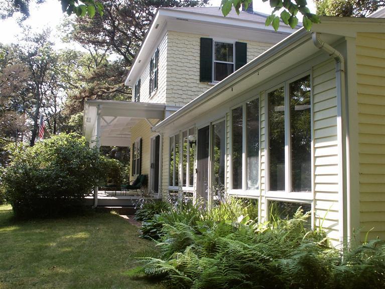 5 Squeteague Harbor Road Cataumet, MA 02534 - Photo 2 of 16 a view of a house with a garden