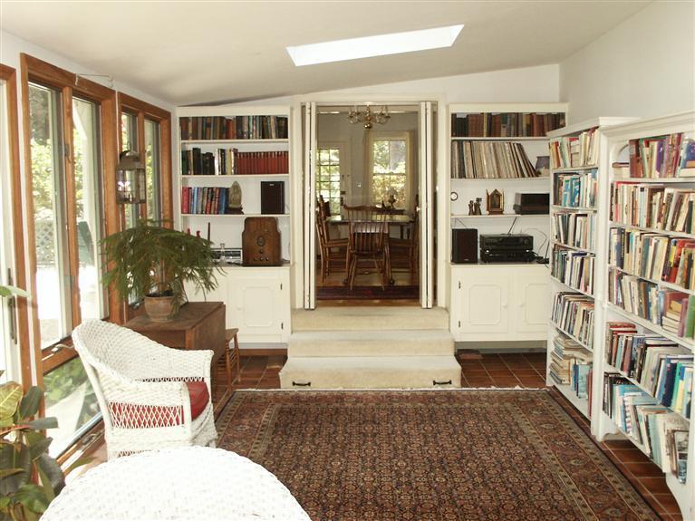 5 Squeteague Harbor Road Cataumet, MA 02534 - Photo 6 of 16 a living room with furniture and book shelf