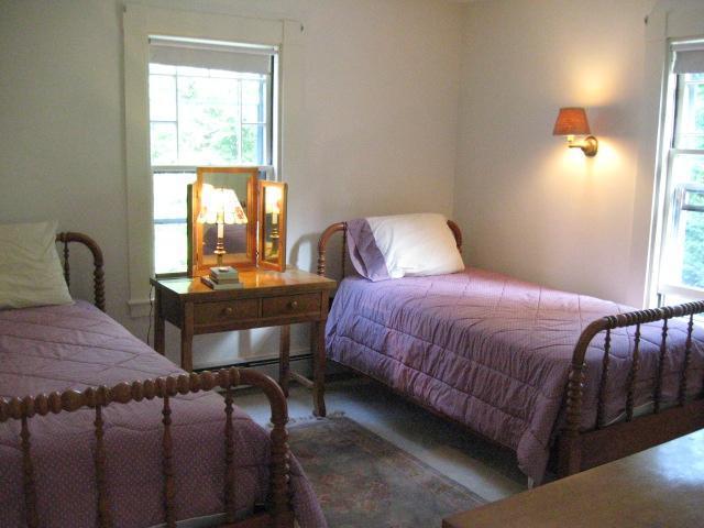 5 Squeteague Harbor Road Cataumet, MA 02534 - Photo 10 of 16 a bedroom with a bed and window