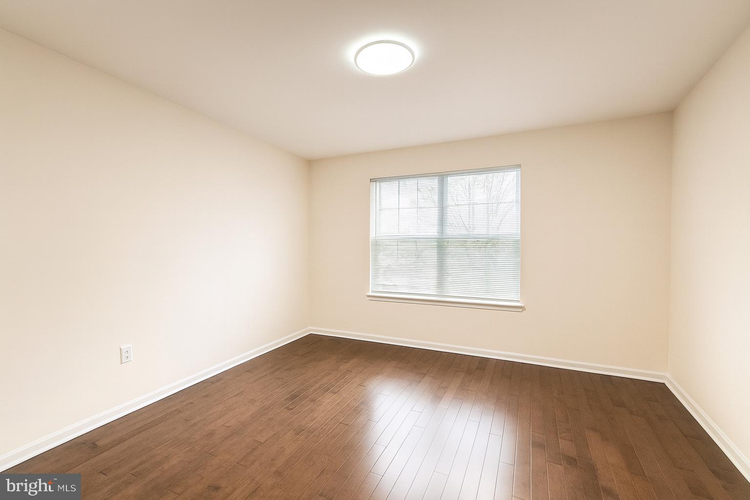 3 Carey Street Pennington, NJ 08534 - Photo 18 of 23 an empty room with wooden floor and windows