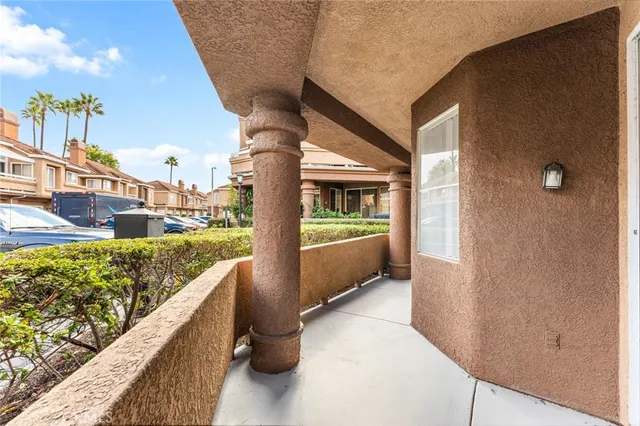 a view of balcony with furniture
