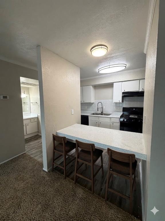 11457 Dennis Road Dallas, TX 75229 - Photo 3 of 6 a kitchen with a table and chairs in it