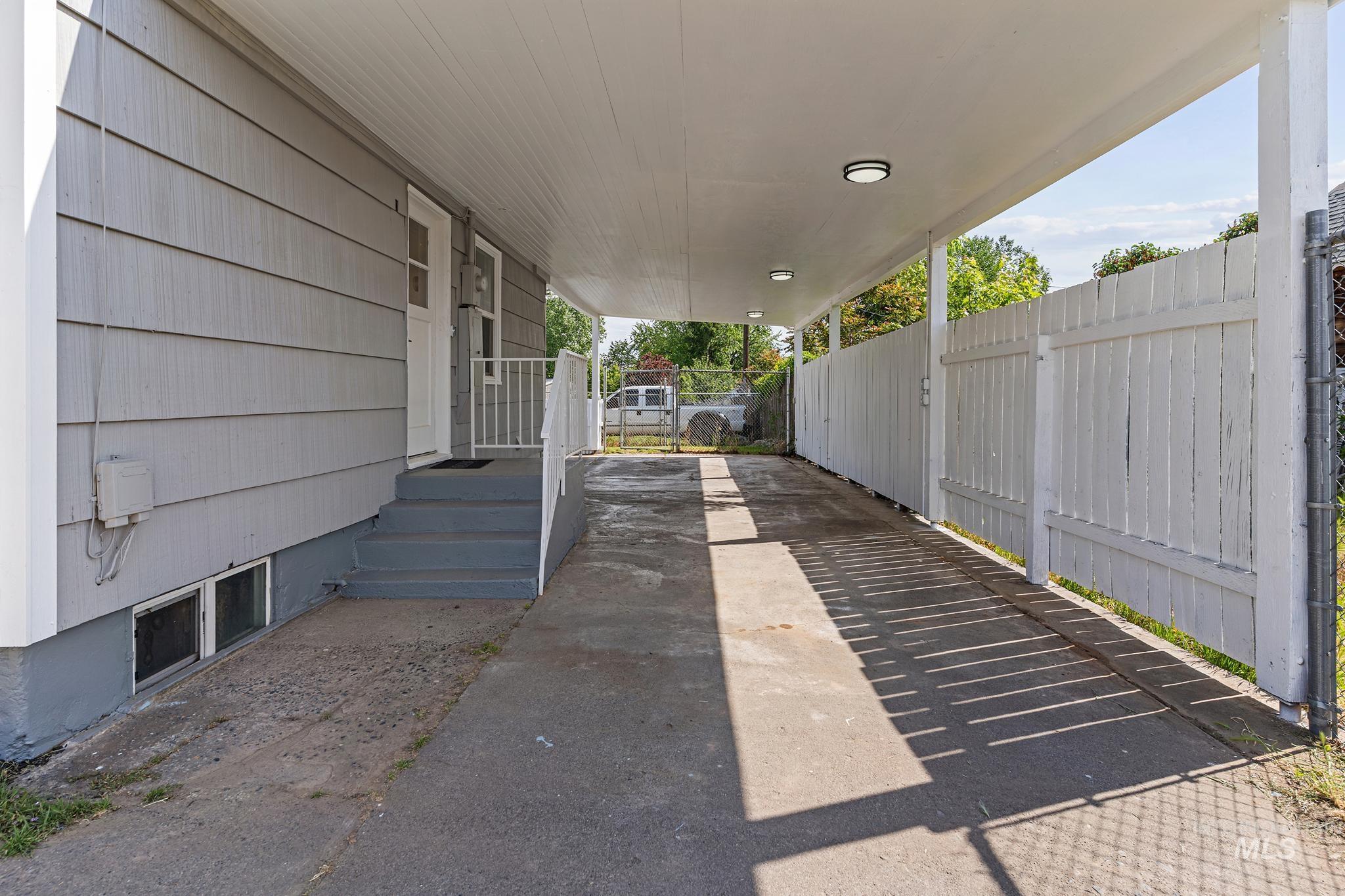 619 Thain Road Lewiston, ID 83501 - Photo 40 of 44 Covered carport with integrated lighting, providing sheltered access to the side entry